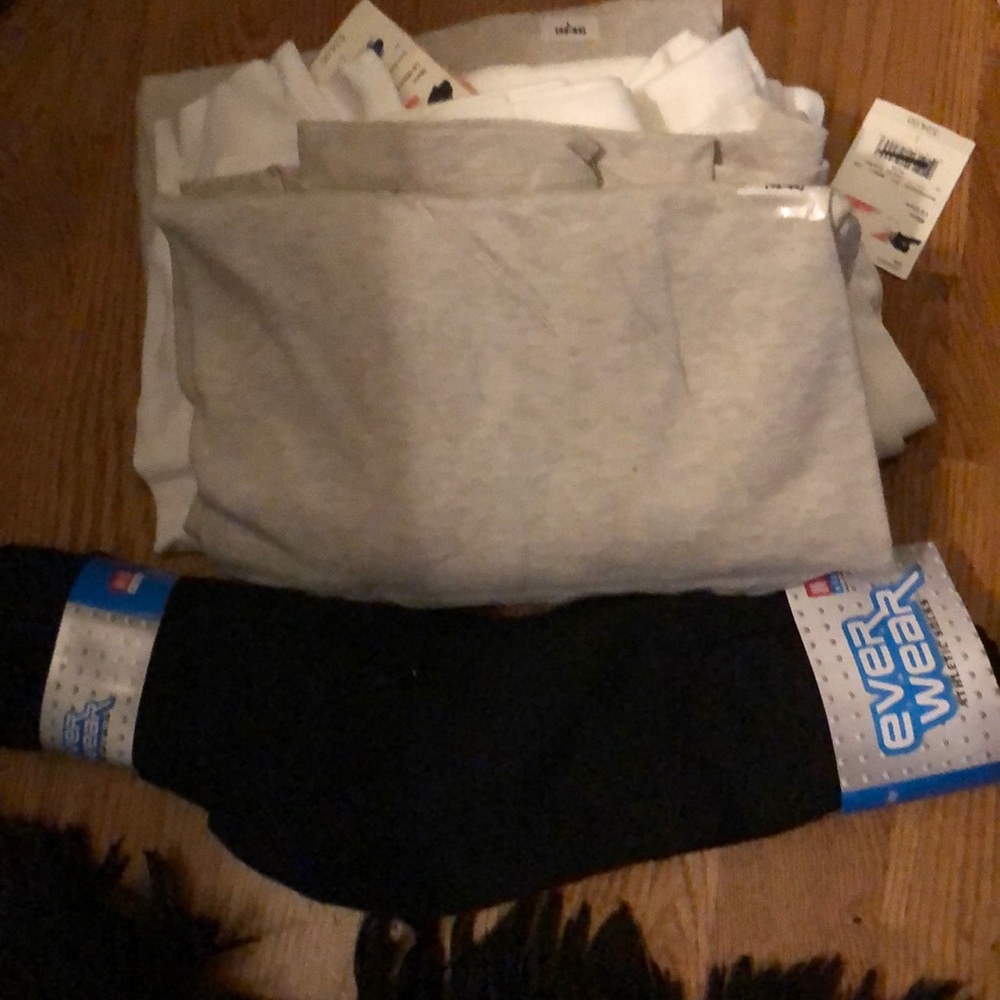 (3) L long sleeves T shirts and one pack of socks